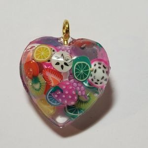 Double sided heart fruit slices pendant.